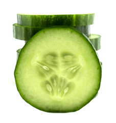 Fresh cucumber slices isolated on white background.