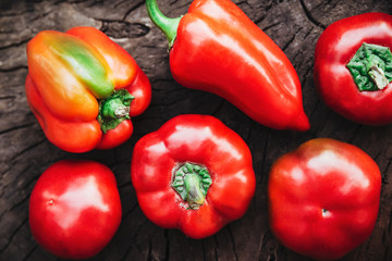 Red bell peppers on the wood.Food background.vegetable ingredient