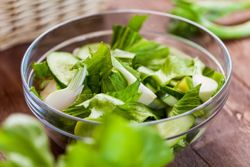 vegetable green salad bowl on kitchen table, balanced diet
