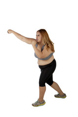 Overweight woman punching something