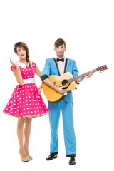 doll looking boy and girl with guitar