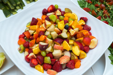 Salad with fresh fruits and berries. Bowl of healthy fresh fruit salad