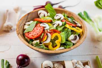 vegetable salad bowl on kitchen table, balanced diet