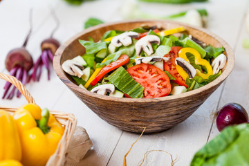 vegetable salad bowl on kitchen table, balanced diet