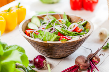 vegetable salad bowl on kitchen table, balanced diet