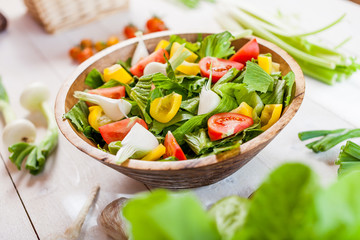 vegetable salad bowl on kitchen table, balanced diet