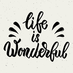 Life is wonderful. Hand drawn lettering phrase isolated on white background.