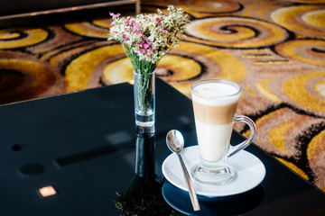 Hot latte coffee cup on table