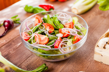 vegetable salad bowl on kitchen table, balanced diet