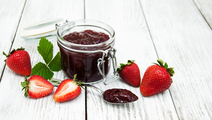 Strawberry jam and fresh strawberries
