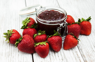 Strawberry jam and fresh strawberries