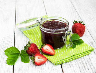 Strawberry jam and fresh strawberries