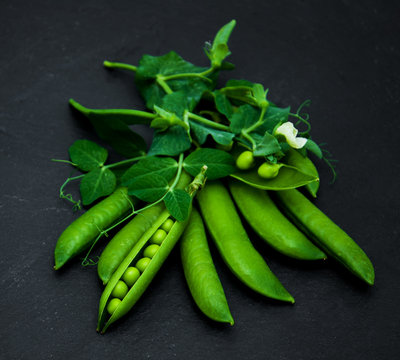 green peas on a stone background
