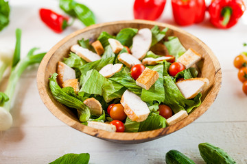 chicken salad bowl on kitchen table, balanced diet