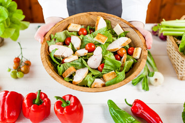 chicken salad bowl on kitchen table, balanced diet