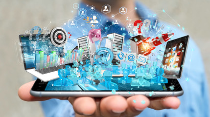 Businessman connecting devices and business objects together 3D rendering