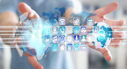 Businessman connecting worlds to icons and applications software 3D rendering