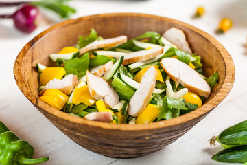 chicken salad bowl on kitchen table, balanced diet