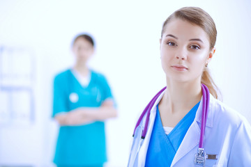 Fototapeta premium Attractive female doctor in front of medical group