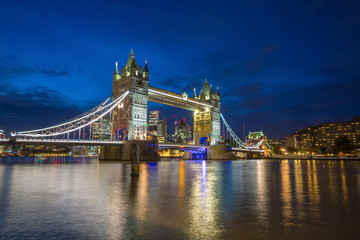 Famous Tower Bridge in the evening with blue sky and reflex on water London England