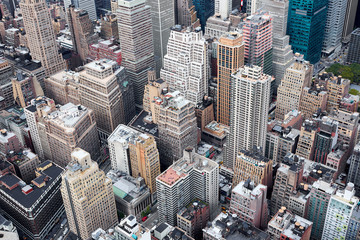 Fototapeta na wymiar NEW YORK CITY - OCTOBER 9, 2014: Close up of facade and roofs of the buildings below Empire State Building