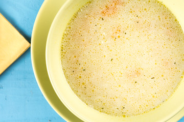 Flat lay soup with vegetables and meat in the bowl