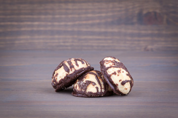 Biscuits with sweet filling on a wooden background.