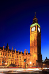 Fototapeta na wymiar Big Ben of the Houses of Parliament at night with car light trails