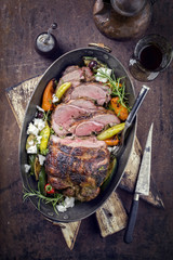 Barbecue lamb roast with vegetable and feta as close-up in a casserole