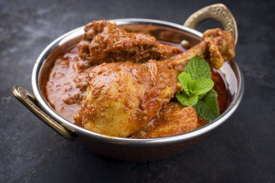 Traditional Indian Chicken Tikka Masala as close-up in a Korai