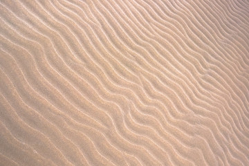 Natural background of sand in ripple wave pattern