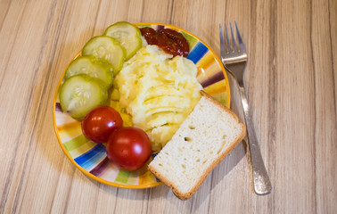 mashed potatoes with cucumber on the plate