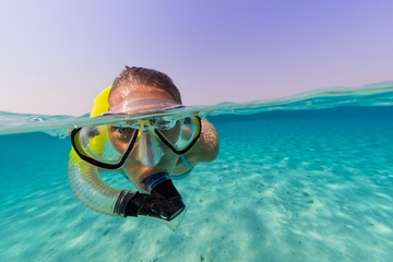 Snorkeling woman exploring beautiful ocean sealife