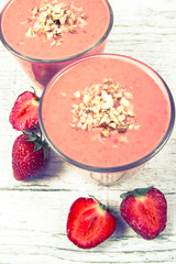 Strawberry smoothie with fresh fruit .