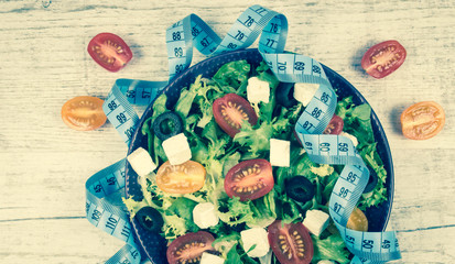 Greek salad with fresh vegetables, feta cheese and black olives.
