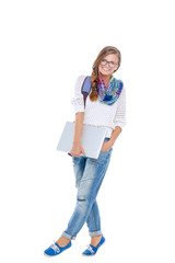 Smiling teenager with laptop on white background. Student.