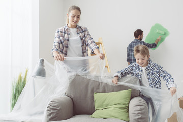 Family painting their home