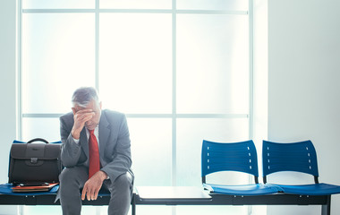 Depressed businessman in the waiting room