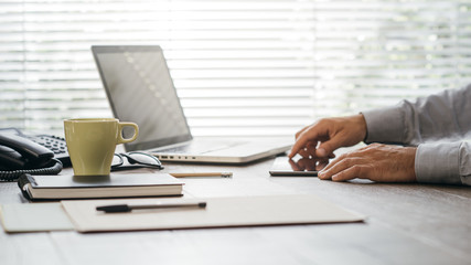 Businessman working at office desk