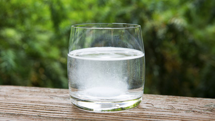 glass of water with effervescent tablet