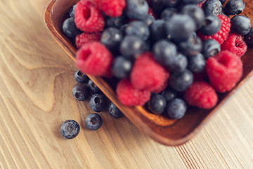 Blueberry and raspberry on a wooden table