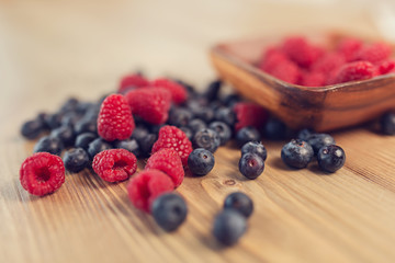 Blueberry and raspberry on a wooden table