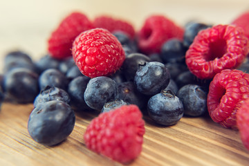 Blueberry and raspberry on a wooden table