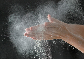 Obraz na płótnie Canvas Hands in flour