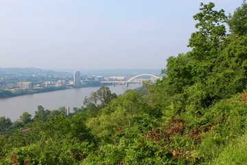Fototapeta premium The yellow bridge and the river from the overlook on the hill.