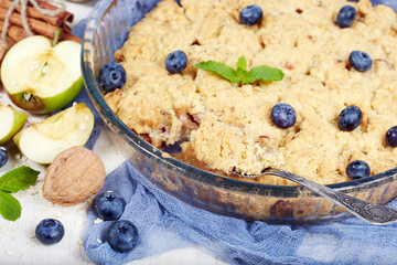 Delicious crumble pie with apples and cinnamon. Sweet dessert.