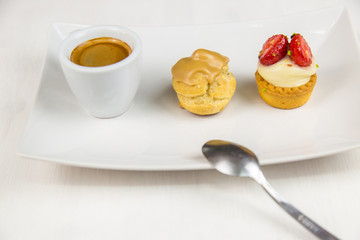 Sicilian pastry and coffee on white dish