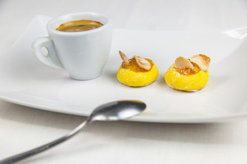 Sicilian pastry and coffee on white dish