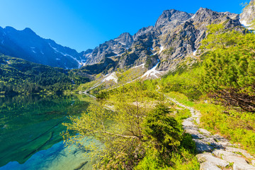 Fototapeta na wymiar View of Morskie Oko lake with emerald green water in summer season, High Tatra Mountains, Poland
