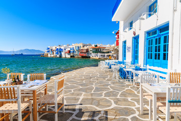 MYKONOS ISLAND, GREECE - MAY 16, 2016: Typical Greek tavern in Little Venice, a part of Mykonos...